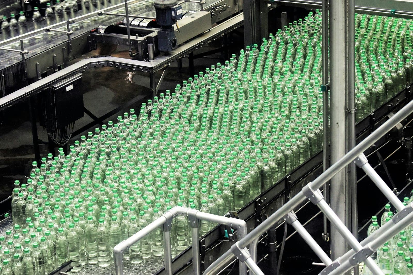 Bottles moving along a machine in a factory