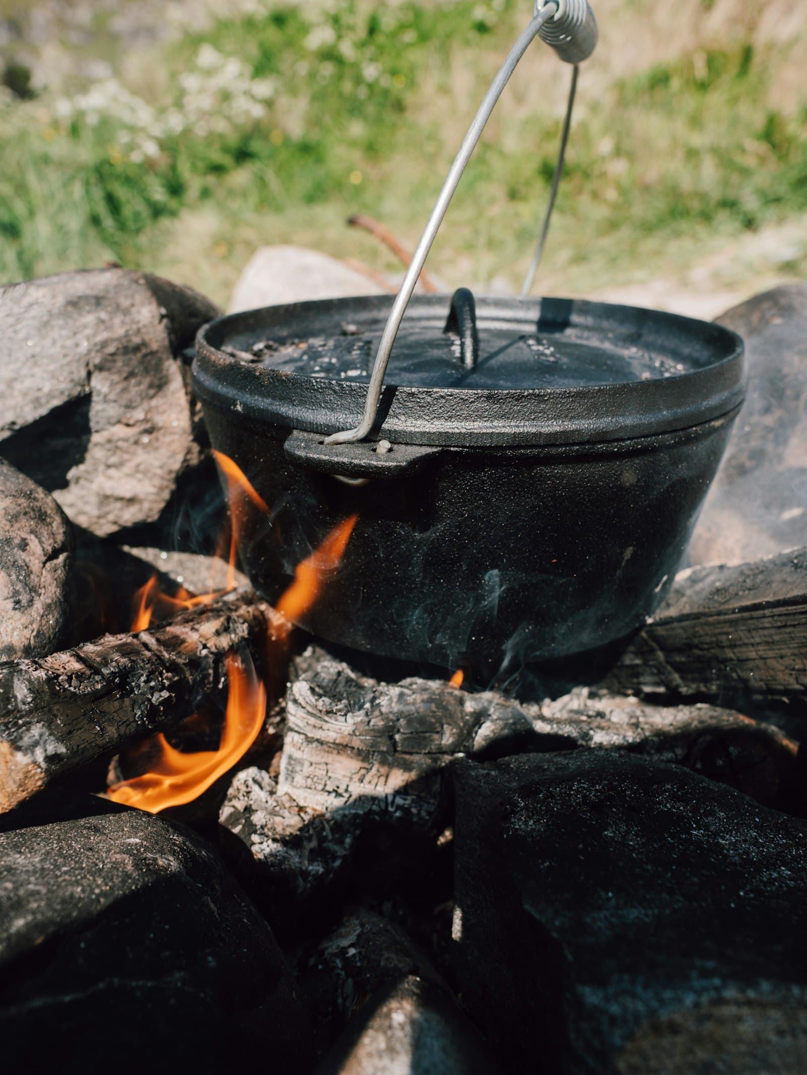 A cooking pot over an open fire