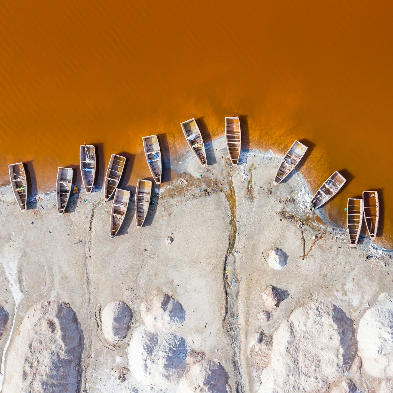 Fishing boats pulled up on a sandy shore